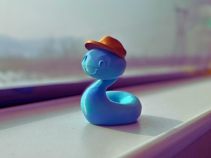 Year of the Snake New Year: A cartoon snake taking a high-speed rail trip during the holiday