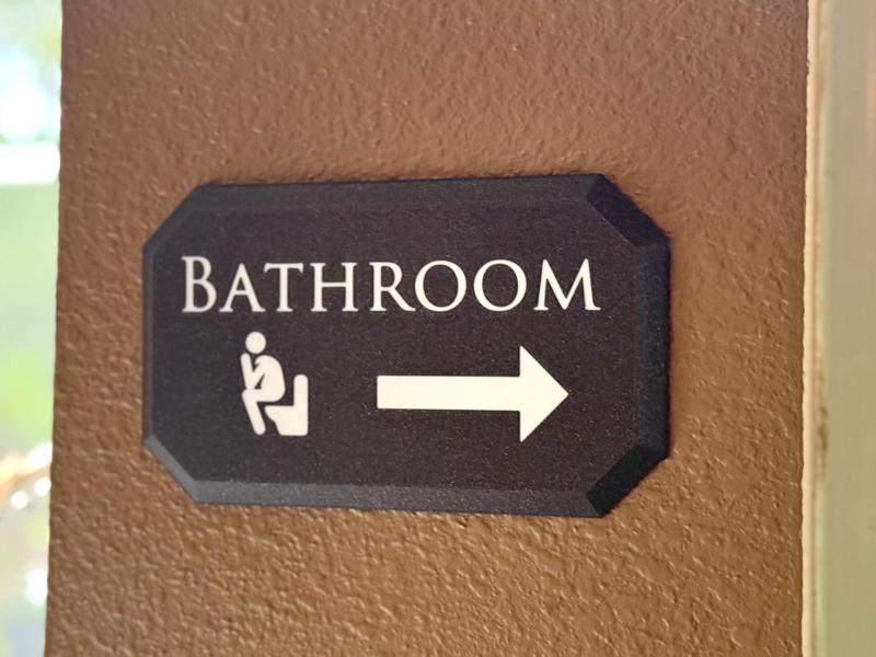 Bathroom Sign with Arrow