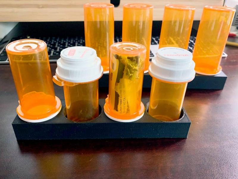 Pill bottle stand for four Walgreens bottle 