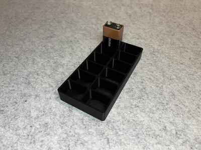 Battery holder for 12 9V batteries