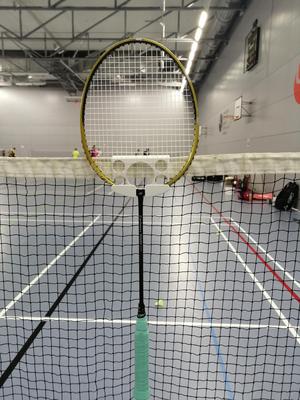 badminton racket holder for net