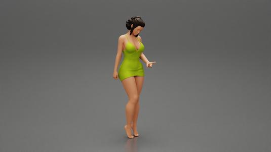 Sexy Girl standing in mini dress on the beach