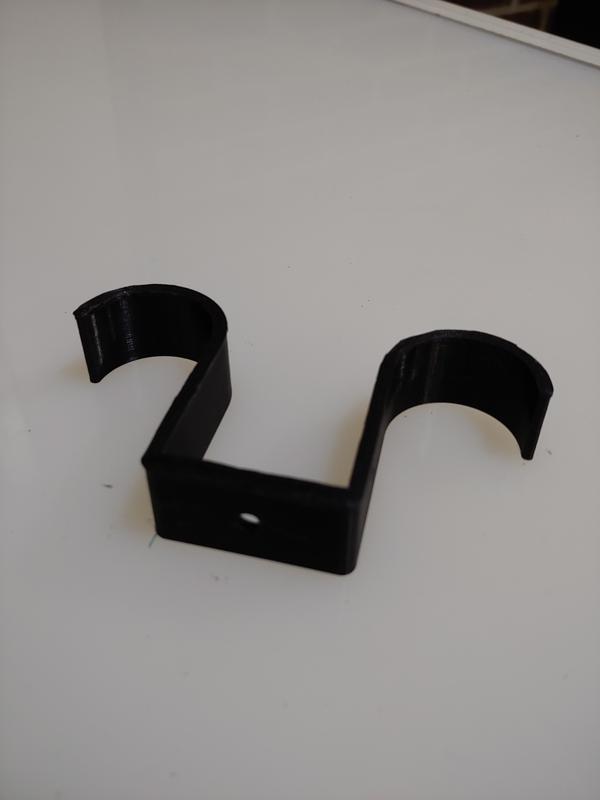 Ceiling mount for fishing poles or other items.