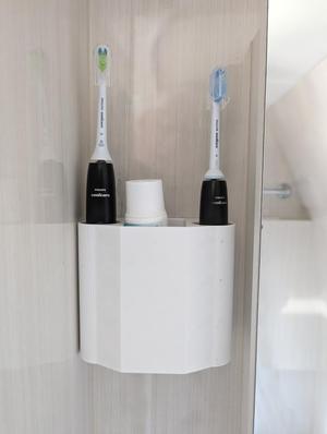 Wall mounted toohbrush holder