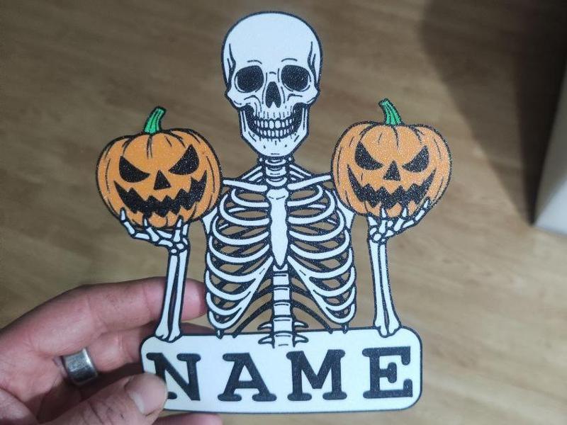 SKELETON WITH PUMPKINS-YOUR NAME