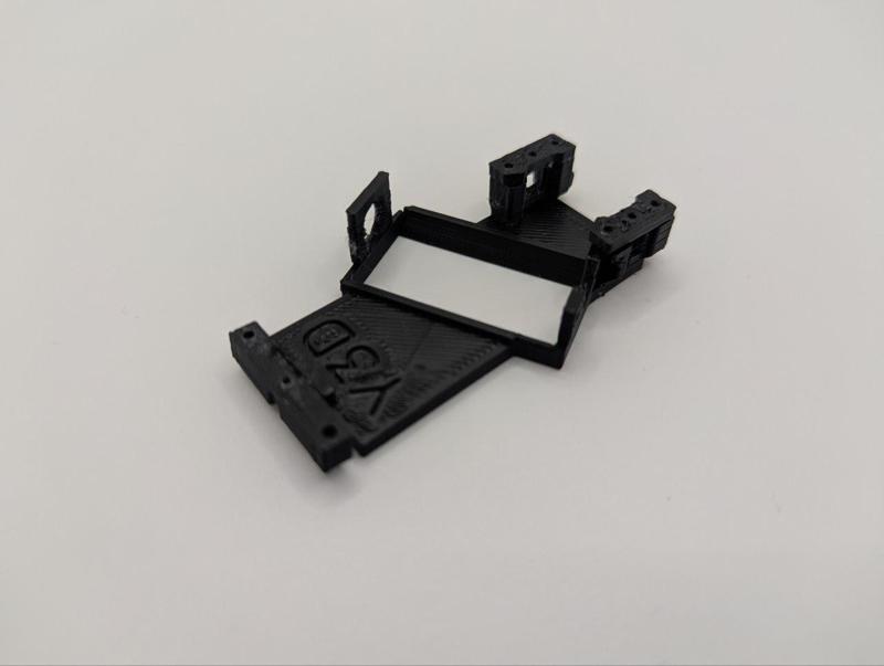 Slot/scalextric angle tilting cradle