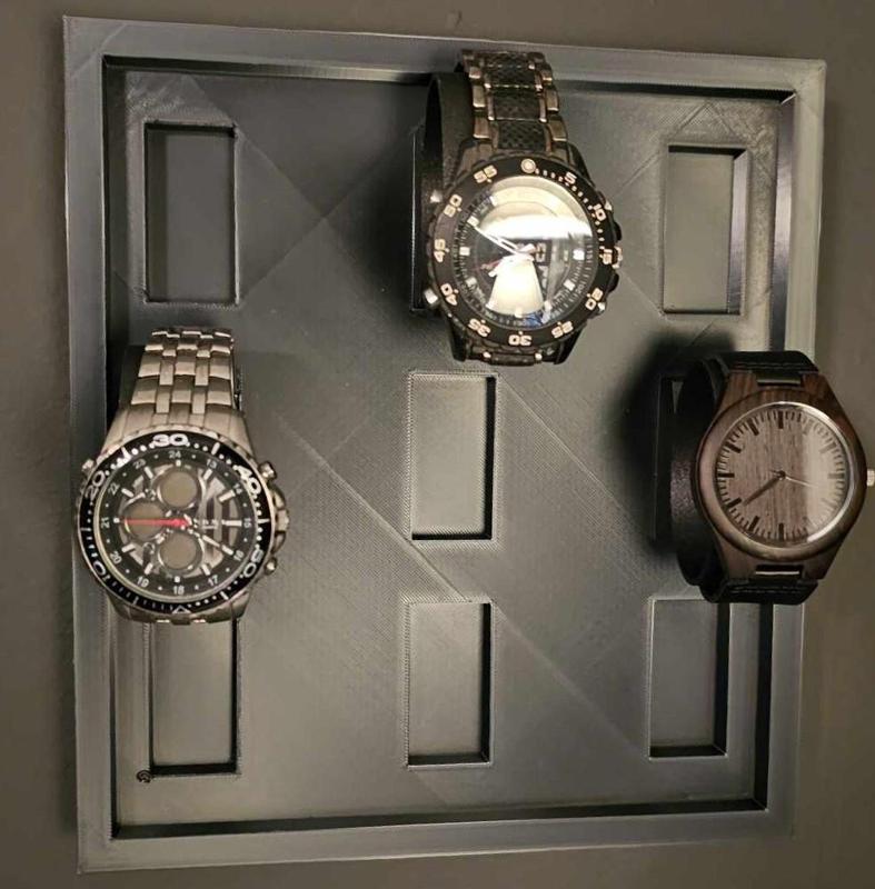 Watch display wall mountable holds 9 watches.