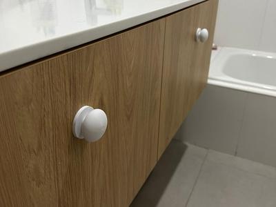 Knob with base and bolt for furniture door