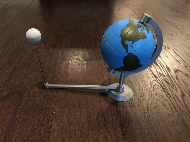 Globe model with stand and orbiting Moon