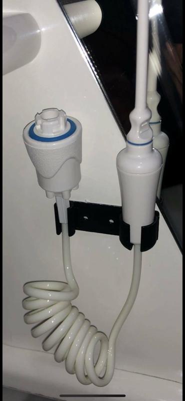 support for dental irrigator/dental water jet