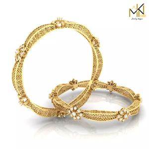 Gold bangle adorned with sparkling diamonds