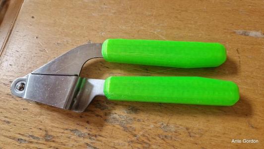 Garlic press handles