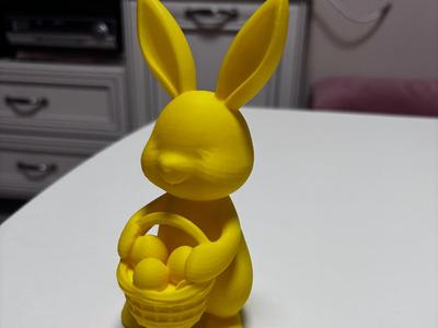 Easter bunny holding egg basket