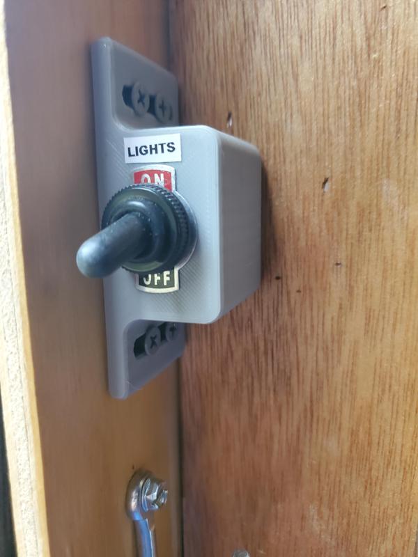 Toggle switch holder for trailer lights