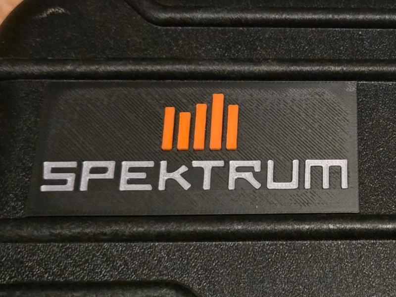 Spektrum logo with background
