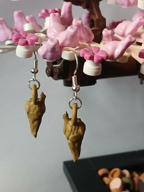 Velociraptor resonance chamber earring