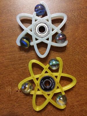 Atom and Curved Marble Spinner