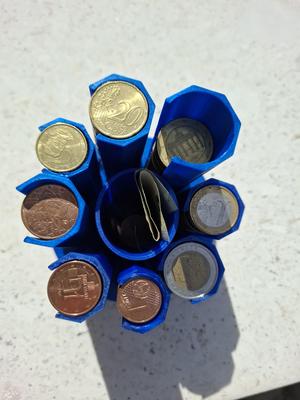 "Free"-Euro-Coin-Pillars with base corresponding to "bank role paper", tagged