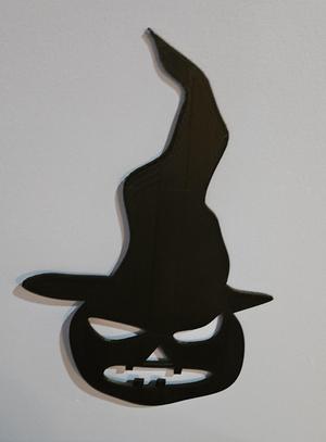 pumpkin with witch hat wall art.