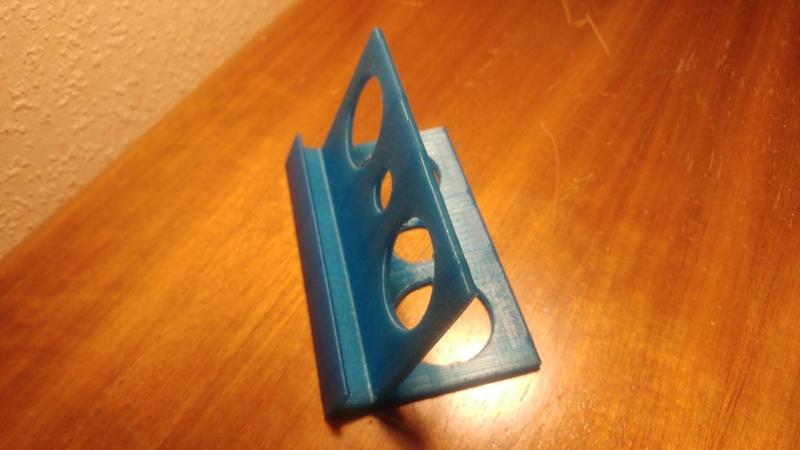 Phone holder charging station film alarm clock