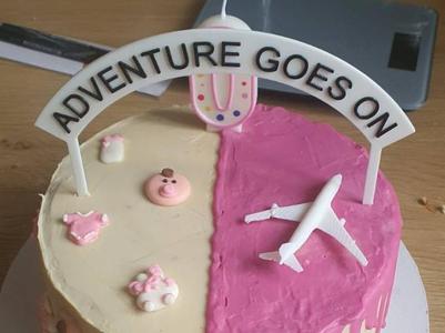 Adventure goes on cake sign