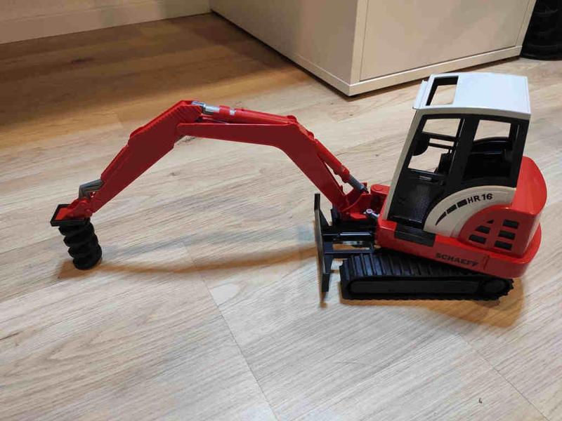 Bruder excavator drill