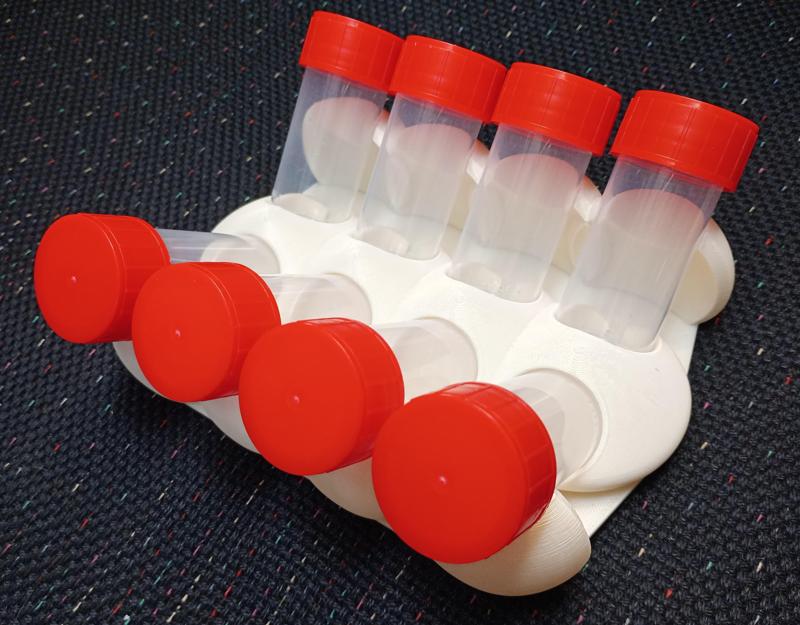 Stand for eight 30mm tubes inclined at 45 degrees in mushroom style design.