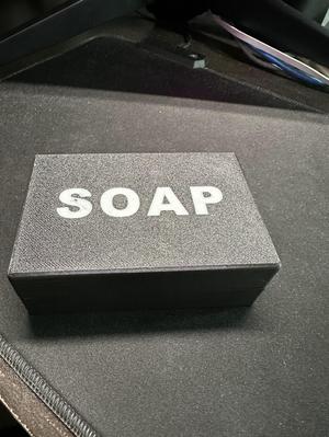 Travel container for a bar of soap