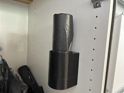 Vertical garbage bag roll holder   