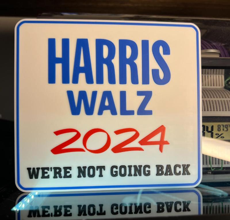 Harris Walz We're not going back sign