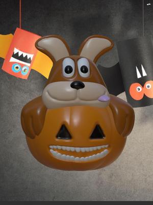 Cute Puppy sitting in a Halloween Pumpkin