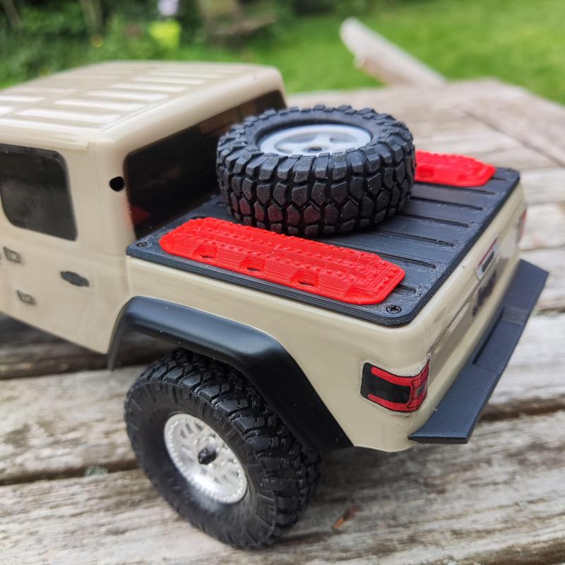 axial SCX24 Jeep Gladiator bed cover with spare wheel and Maxtrax plates