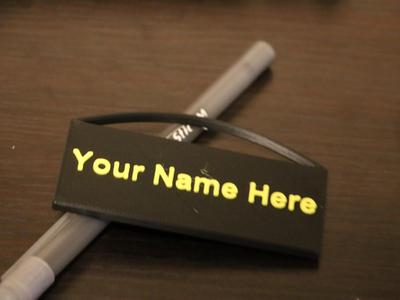 Keychain with top loop and name