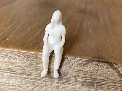 Small sitting, relaxed woman