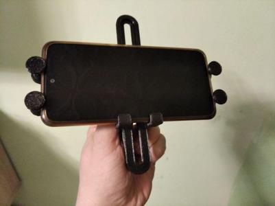 Scissors-based gravity phone holder