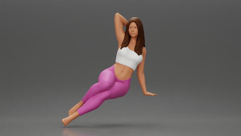 Fit girl in leggings sitting on a sofa