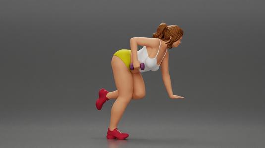 Fitness girl in the gym training with a single-arm dumbbell row