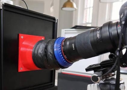 An adapter for a Canon 180mm macro lens