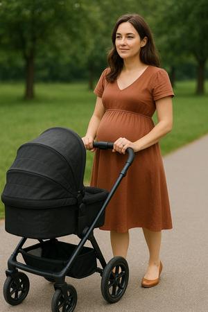Woman with baby carriage and pregnant
