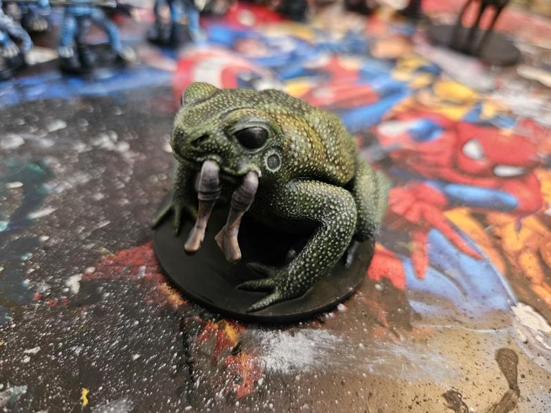 Giant Toad eating an adventurer
