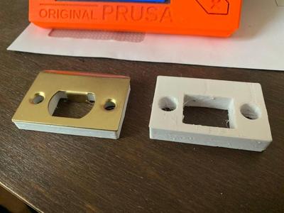 Strike plate spacer