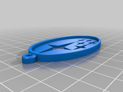 Subaru keychain (with a yellow stars)