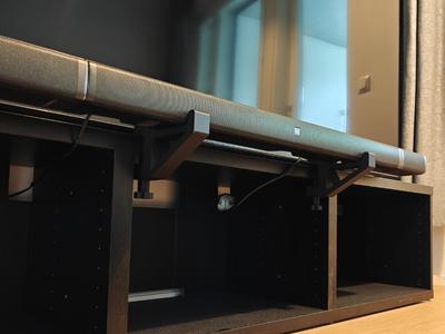 Soundbar TV-Stand mount with an adjustable clamp