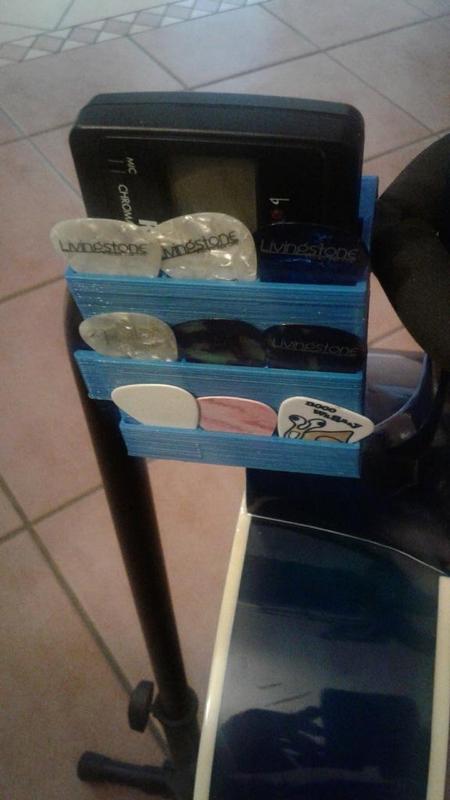 Guitar tuner (Korg CA-30) and pick holder