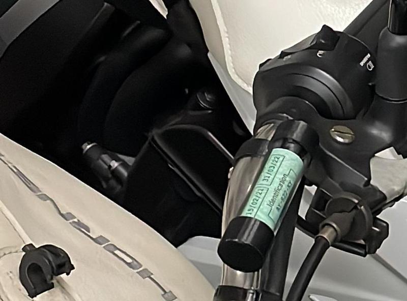 Motorcycle insurance sticker handlebar holder