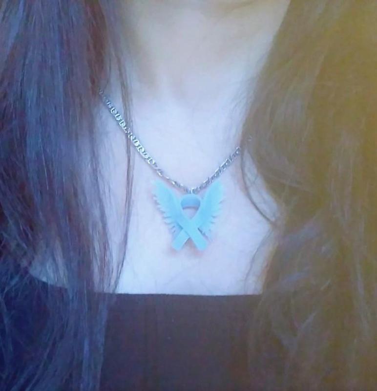 Necklace, artifact, pin,and key chain (hero ribbon) for stopping woman abuse