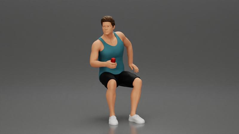 man sitting holding a can and wearing a tank top and shorts