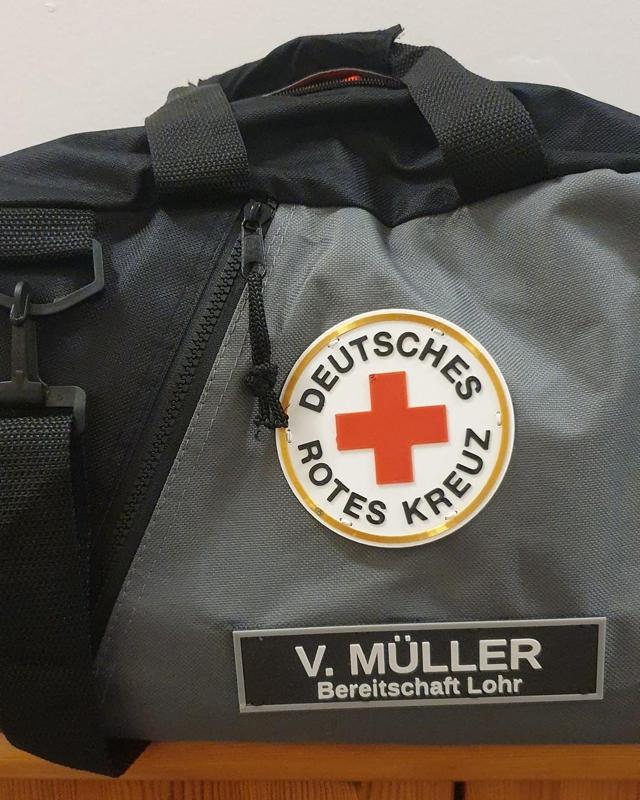 DRK-Rundlogo und -Pin