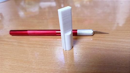 Cap for a scalpel