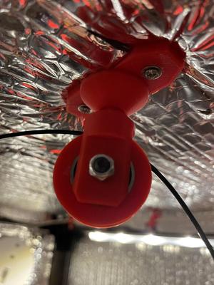 Hanging Filament Guide with Swivel for a Low Ceiling Enclosure.